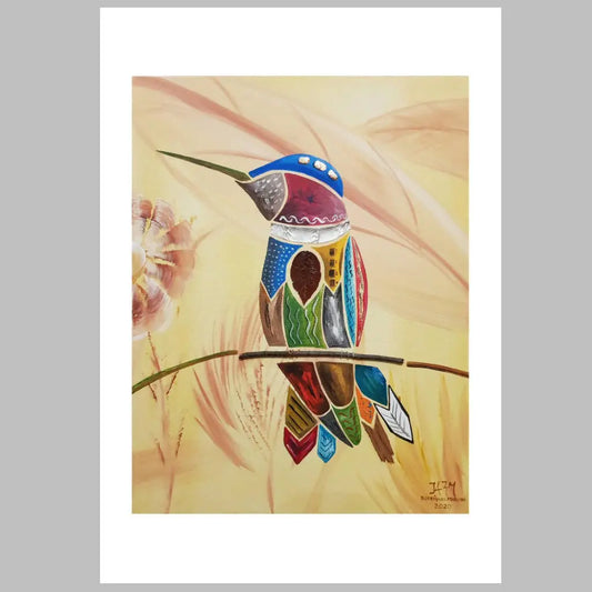 Colibrí descansando en una rama